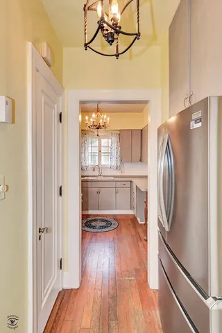 a kitchen with stainless steel appliances a refrigerator and a stove top oven