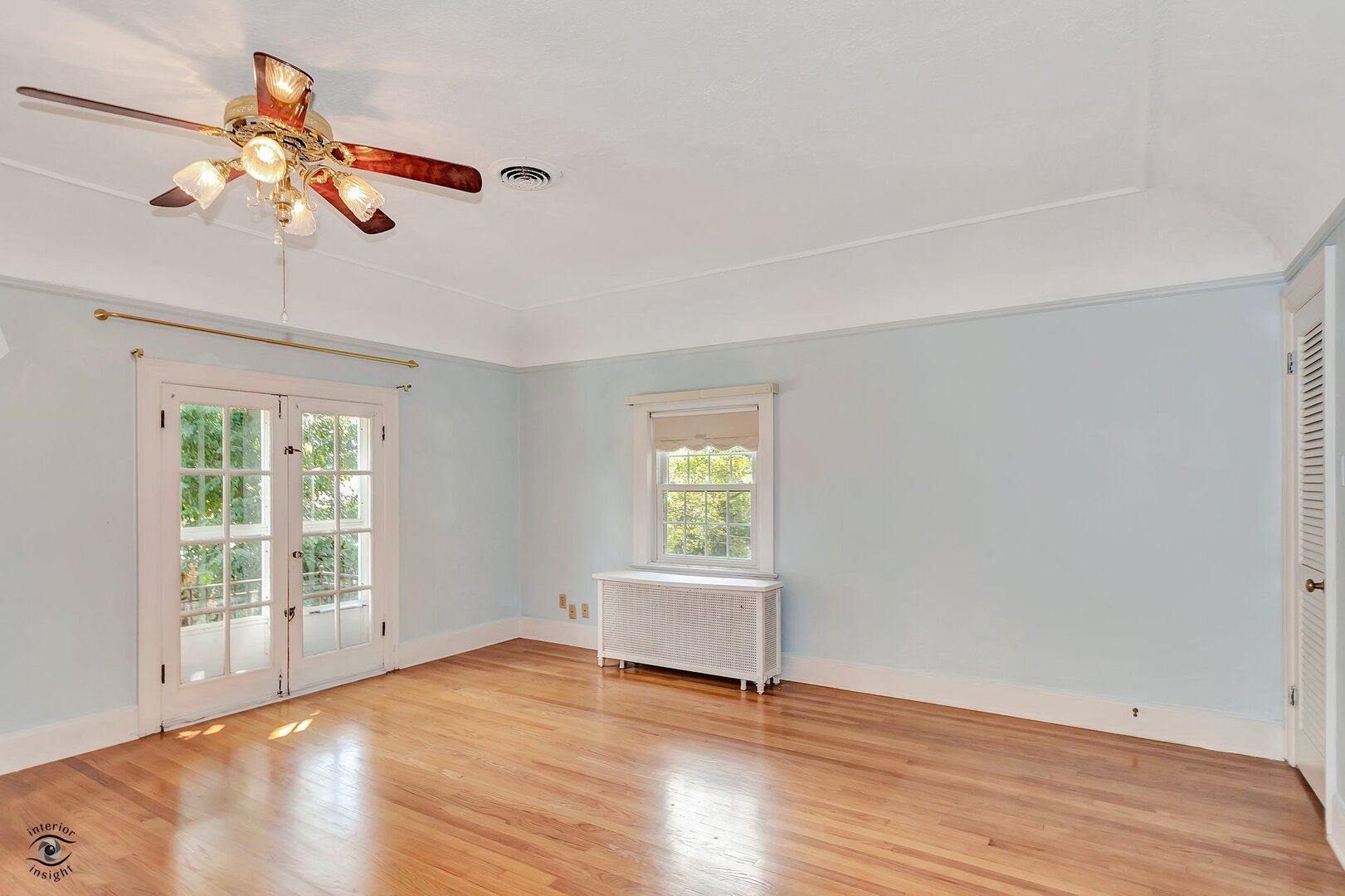 1096 South Wildwood Avenue Kankakee, IL 60901 - Photo 21 of 38 an empty room with wooden floor fan and windows