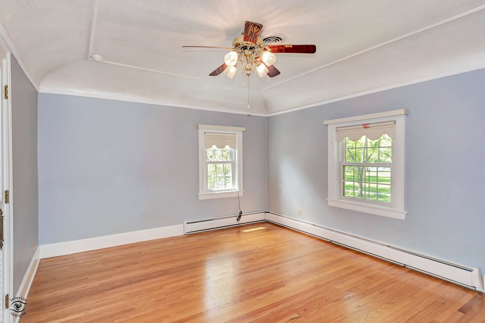 1096 South Wildwood Avenue Kankakee, IL 60901 - Photo 22 of 38 a view of an empty room with wooden floor and a window