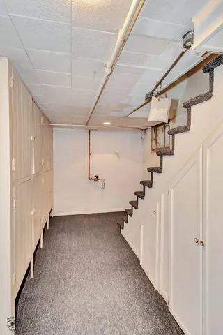 a view of a hallway with stairs