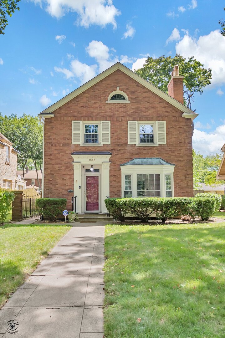 1096 South Wildwood Avenue Kankakee, IL 60901 - Photo 37 of 38 a front view of a house with a yard