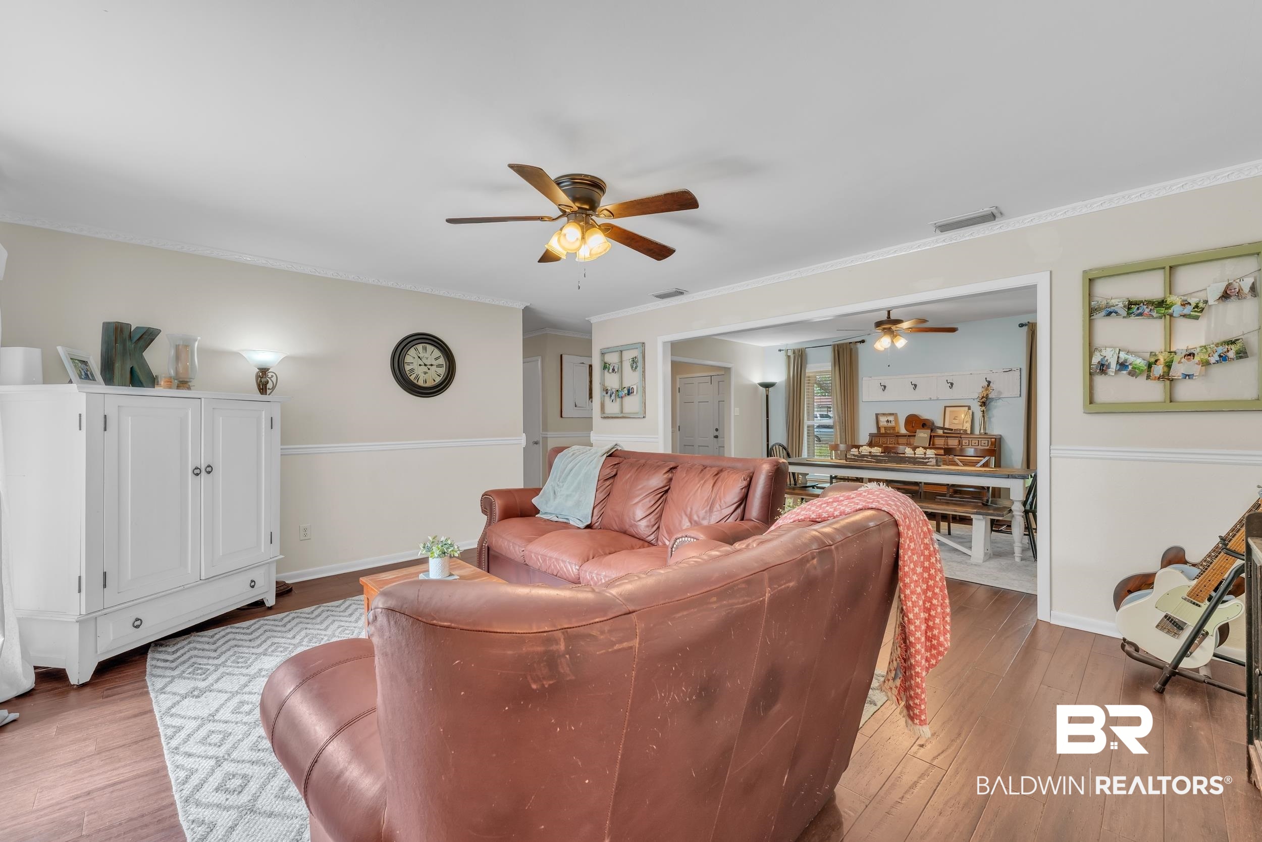 224 Cache Circle Mobile, AL 36611 - Photo 11 of 42 Living room with a ceiling fan, wood finished floors, ornamental molding, and baseboards