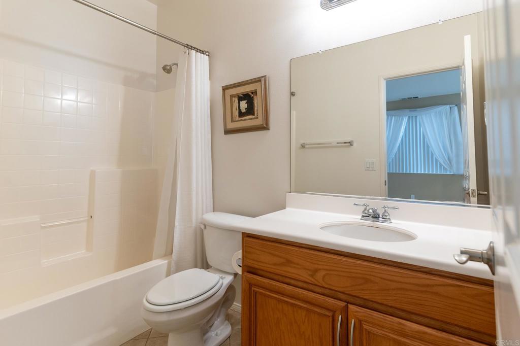 45160 Jumi Circle Temecula, CA 92592 - Photo 14 of 37 a bathroom with a sink toilet and shower