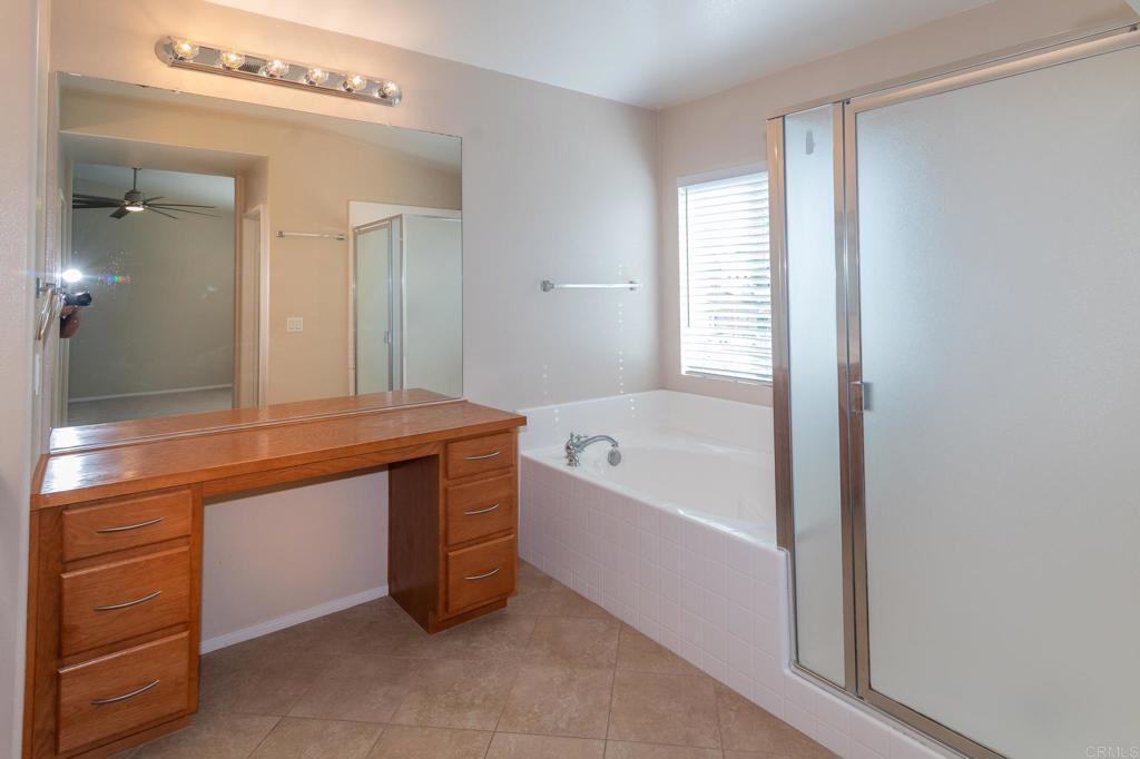 45160 Jumi Circle Temecula, CA 92592 - Photo 18 of 37 a spacious bathroom with a bathtub and a sink