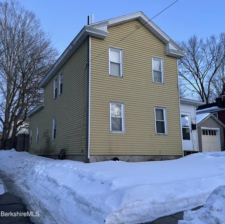a front view of house with a yard