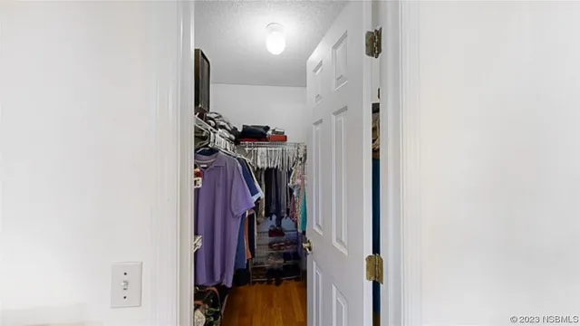 a view of a closet with storage