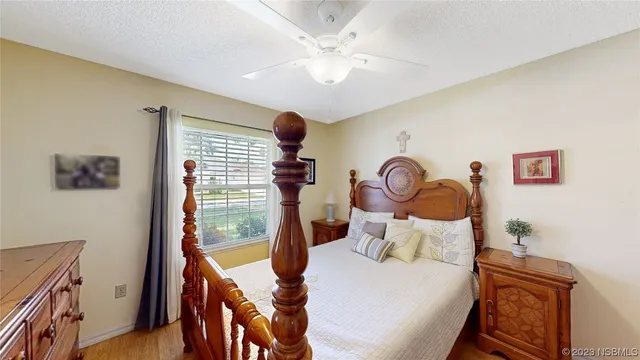 a bedroom with furniture and a window