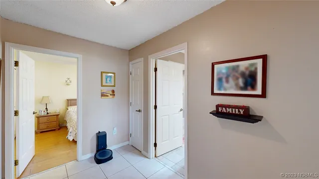 a bedroom with a bed and a view of en suite bathroom