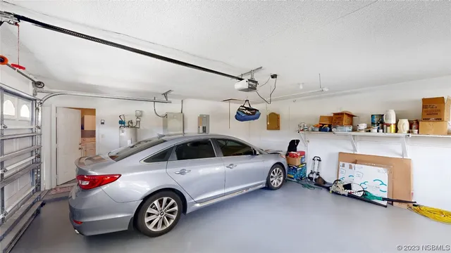 a view of parking garage with cars