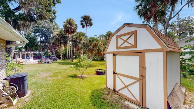 a view of swimming pool with a backyard