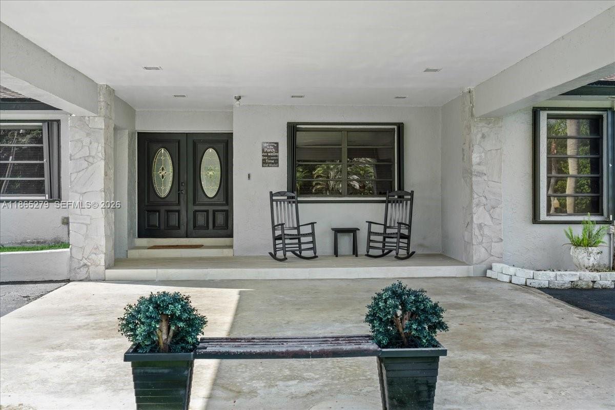 19926 Southwest 326th Street Homestead, FL 33030 - Photo 24 of 46 a front view of a house with outdoor seating