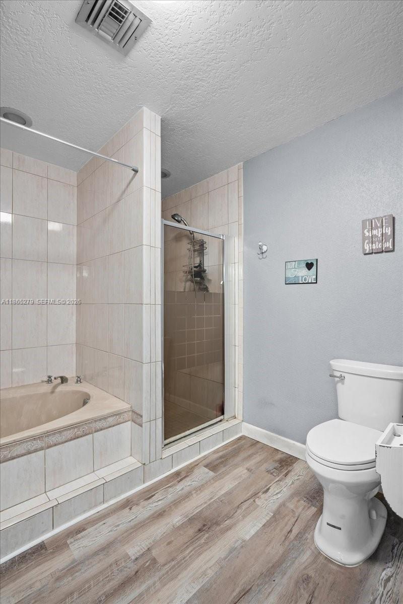 19926 Southwest 326th Street Homestead, FL 33030 - Photo 36 of 46 a bathroom with a bathtub and a shower