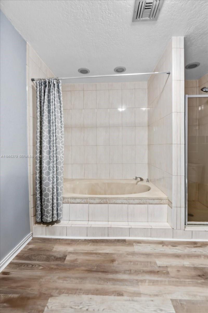 19926 Southwest 326th Street Homestead, FL 33030 - Photo 38 of 46 a view of a bathroom with bathtub and shower