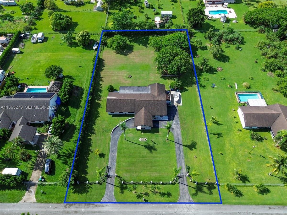 19926 Southwest 326th Street Homestead, FL 33030 - Photo 4 of 46 an aerial view of a house with a yard basket ball court and outdoor seating