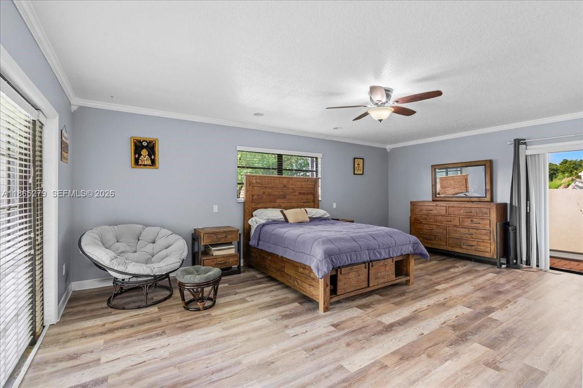 19926 Southwest 326th Street Homestead, FL 33030 - Photo 8 of 46 a bedroom with a bed and dresser