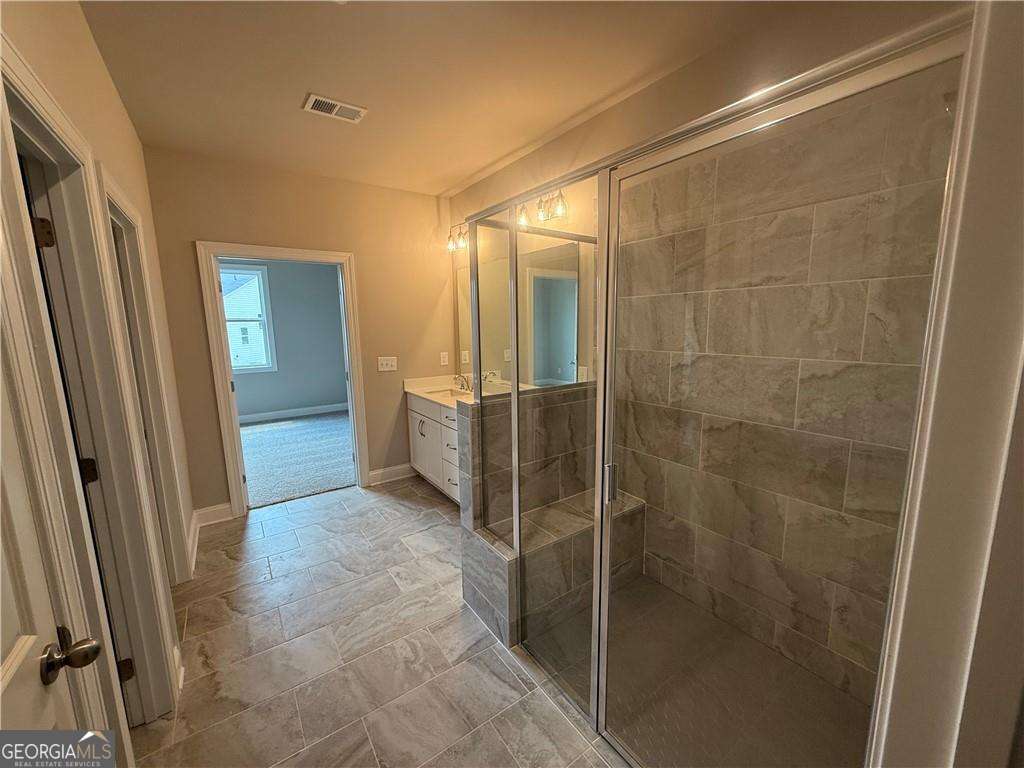 352 Lakeside Drive Canton, GA 30115 - Photo 11 of 16 a bathroom with a shower and a sink