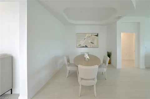 a white bath tub sitting next to a white toilet