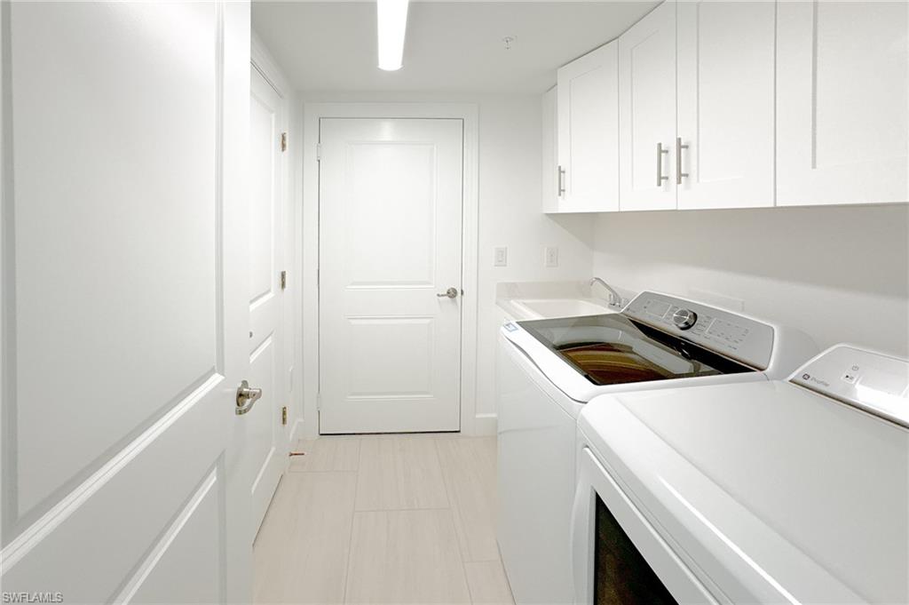 16881 Fairgrove Way, Unit 7102 Naples, FL 34110 - Photo 28 of 50 a utility room with dryer and washer
