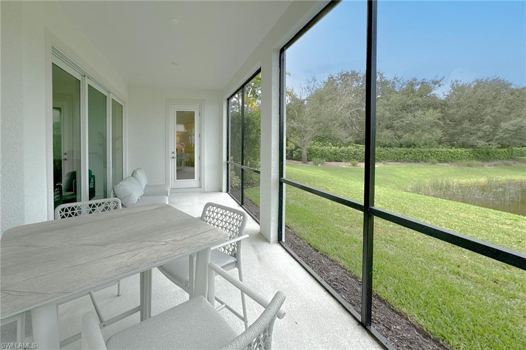16881 Fairgrove Way, Unit 7102 Naples, FL 34110 - Photo 30 of 50 a view of a room with a large window