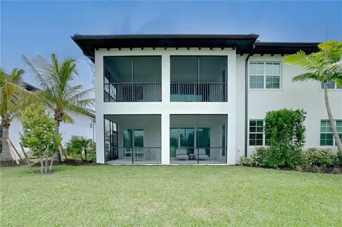 a view of a balcony with lake view and a floor to ceiling window