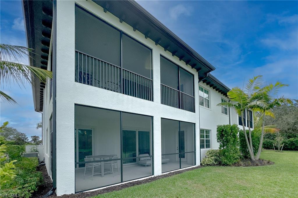 16881 Fairgrove Way, Unit 7102 Naples, FL 34110 - Photo 33 of 50 a view of a house with a yard