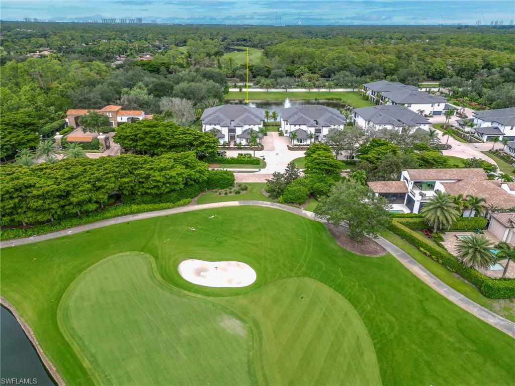 16881 Fairgrove Way, Unit 7102 Naples, FL 34110 - Photo 38 of 50 an aerial view of residential houses with outdoor space and street view