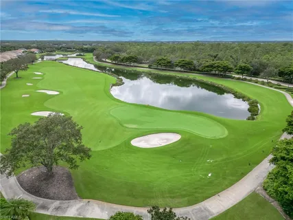 an aerial view of residential houses with outdoor space and street view