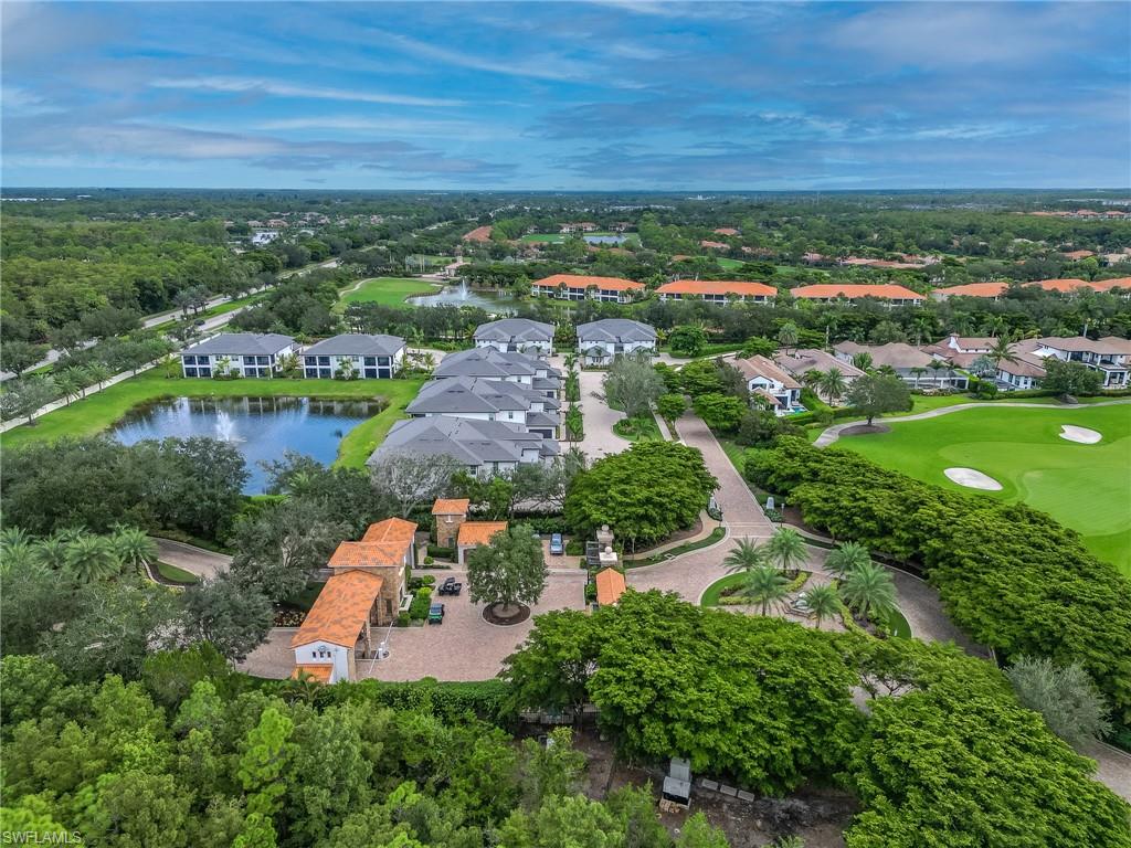 16881 Fairgrove Way, Unit 7102 Naples, FL 34110 - Photo 42 of 50 an aerial view of residential houses with outdoor space and street view