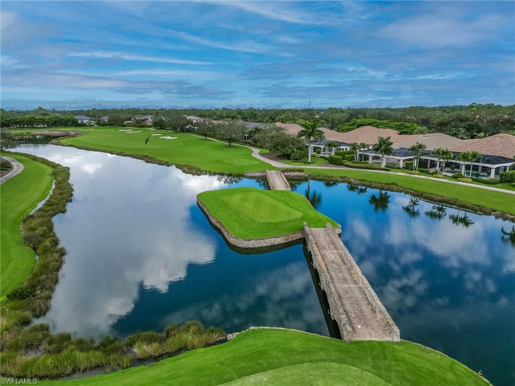 16881 Fairgrove Way, Unit 7102 Naples, FL 34110 - Photo 43 of 50 an aerial view of a house with a yard