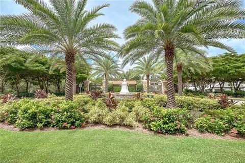 a view of a park with large trees