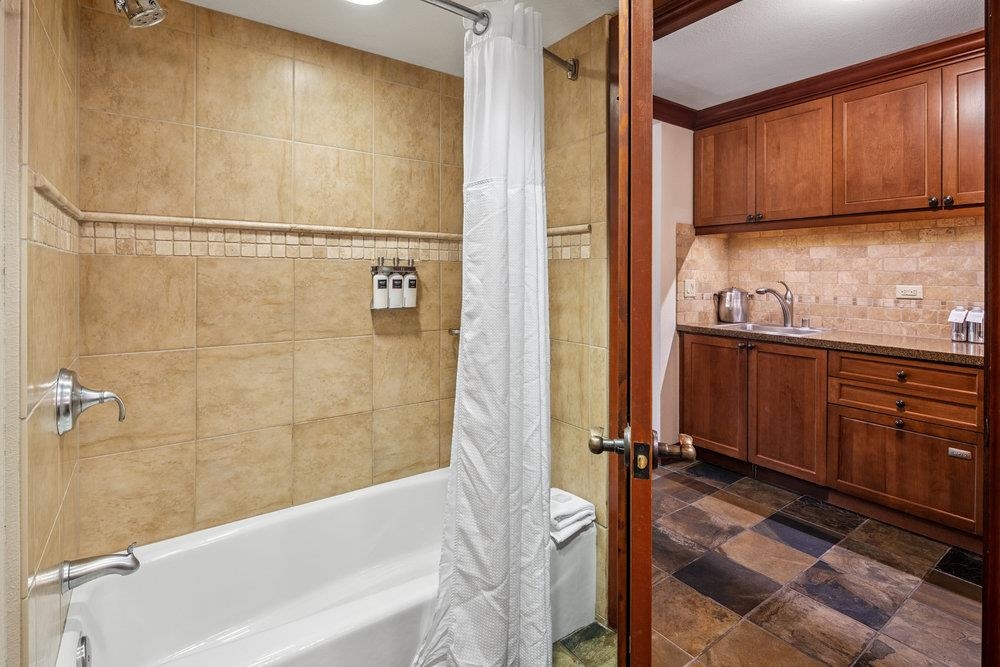 400 Resort Road, Unit 655 Olympic Valley, CA 96146 - Photo 18 of 28 a bathroom with a sink a toilet and bathtub