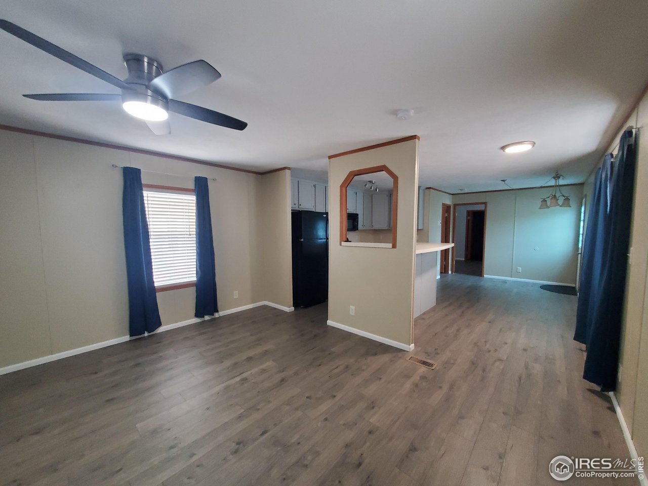 3717 South Taft Hill Road, Unit 285 Fort Collins, CO 80526 - Photo 3 of 18 a view of empty room with wooden floor