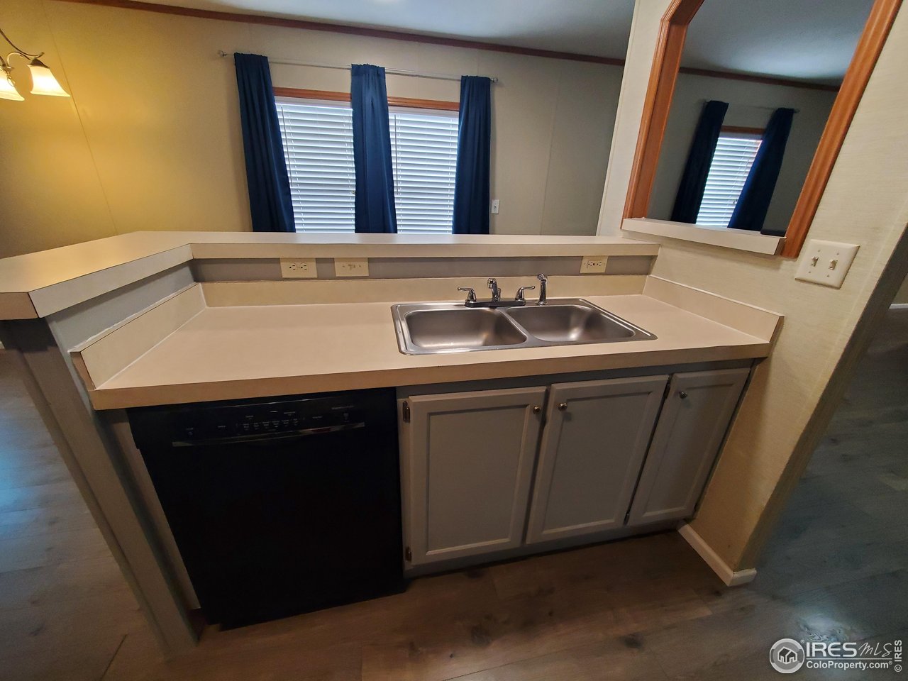 3717 South Taft Hill Road, Unit 285 Fort Collins, CO 80526 - Photo 6 of 18 a bathroom with a sink and a mirror