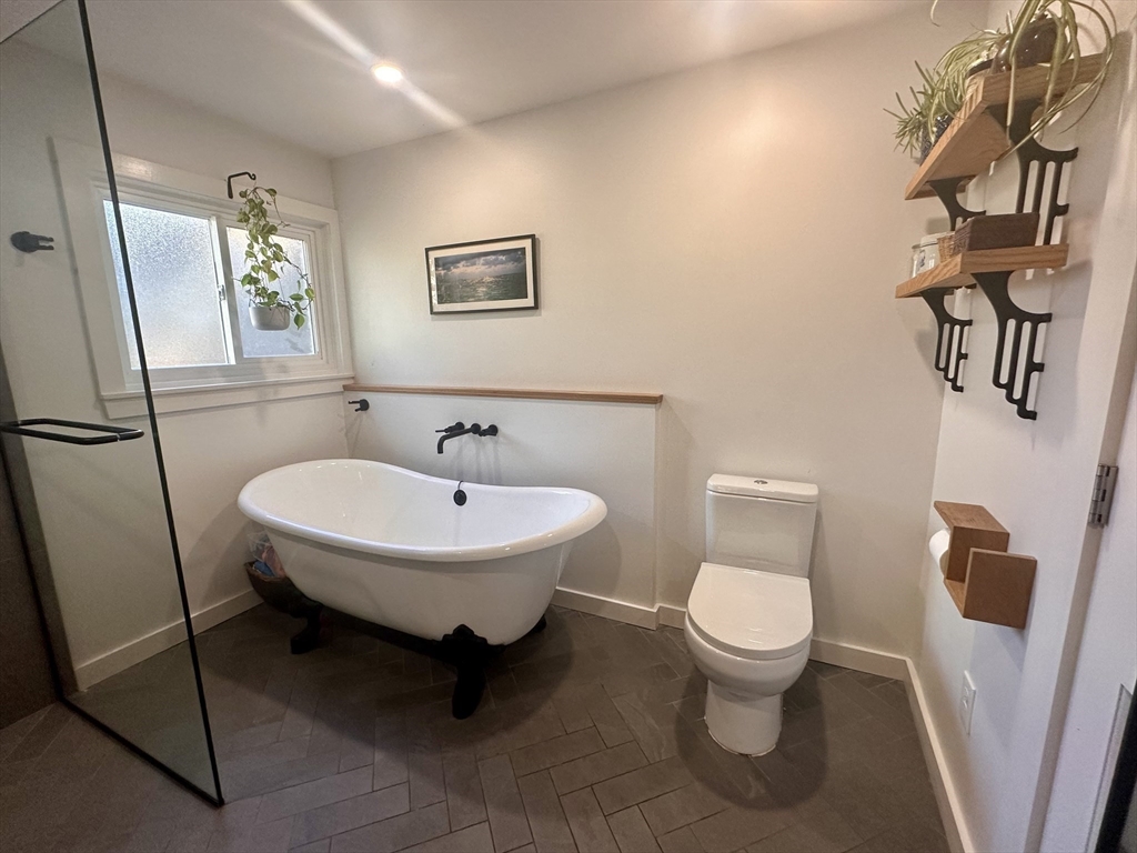 33 William Street Buckland, MA 01370 - Photo 16 of 30 a bathroom with a toilet a sink and mirror