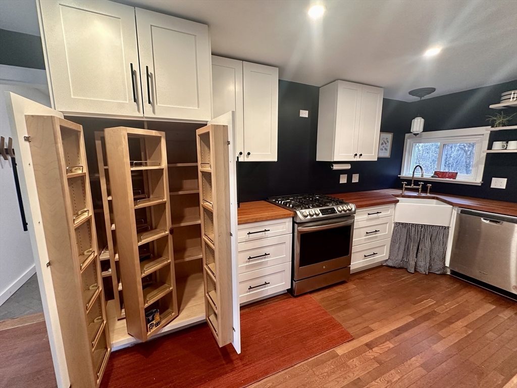 33 William Street Buckland, MA 01370 - Photo 7 of 30 a kitchen with stainless steel appliances a stove a sink and a refrigerator