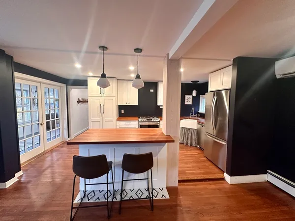 a view of a dining room with furniture window and outside view