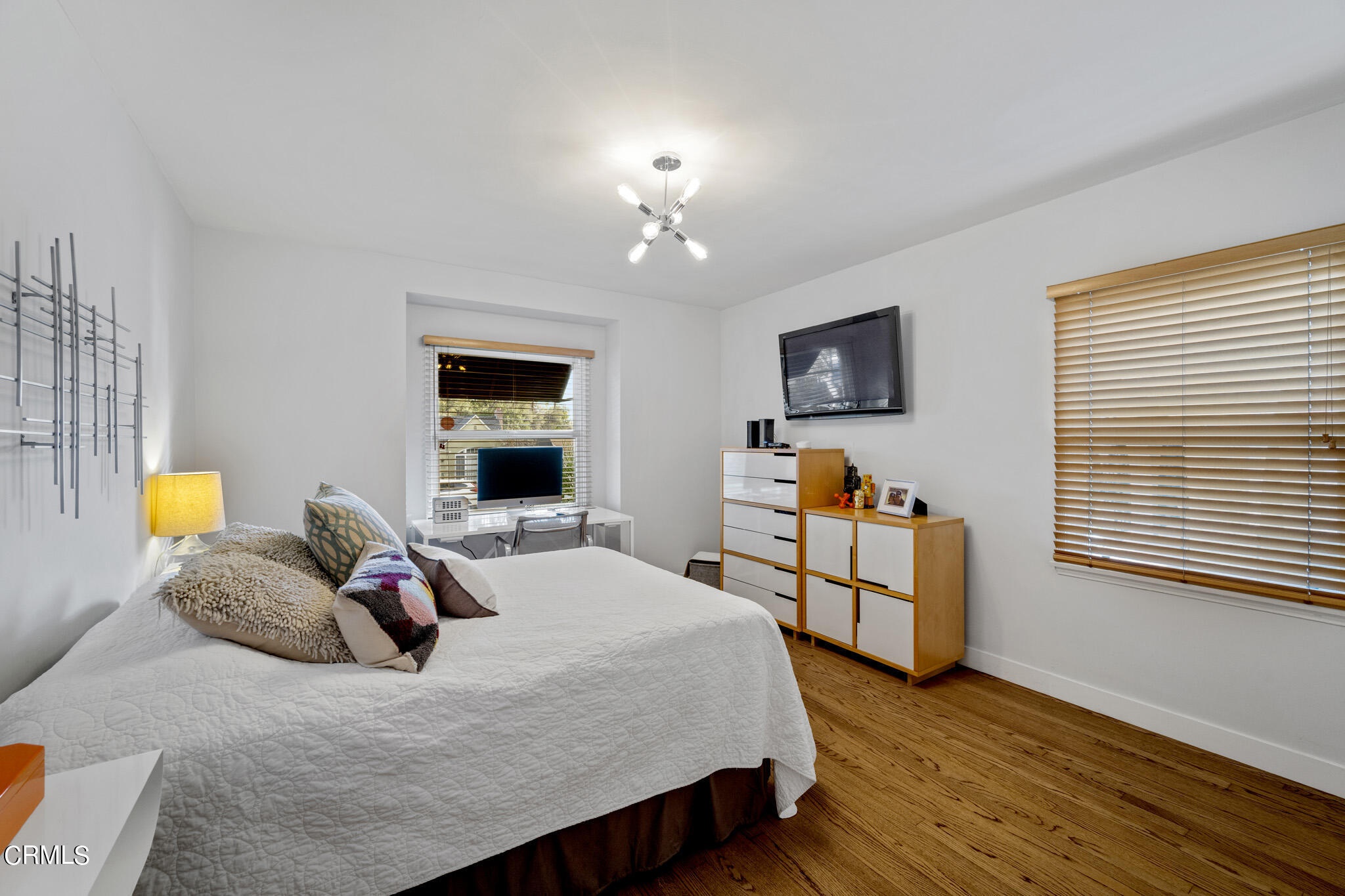 1817 Harmon Place Glendale, CA 91208 - Photo 23 of 45 a bedroom with a bed and wooden floor