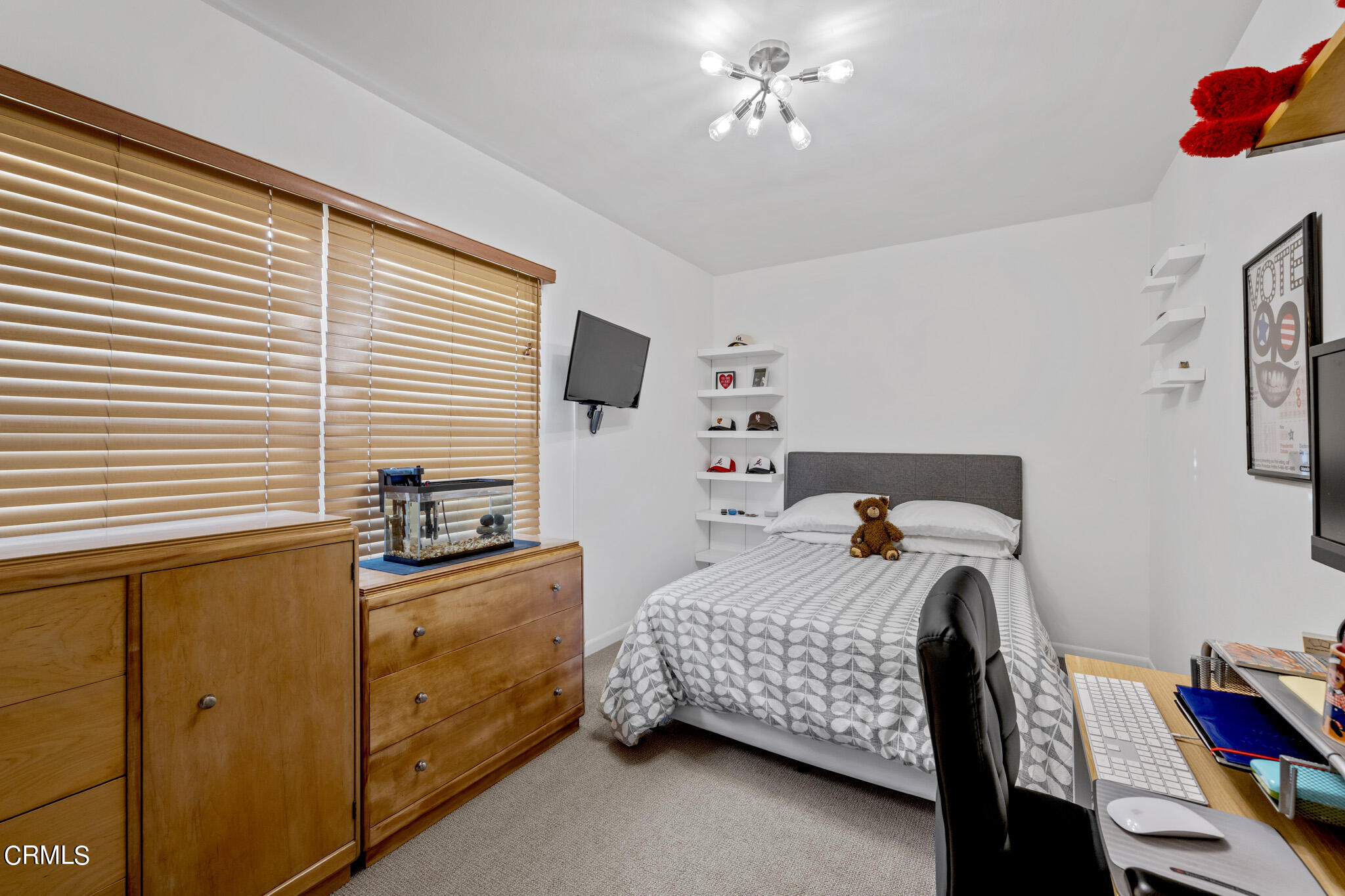 1817 Harmon Place Glendale, CA 91208 - Photo 27 of 45 a bedroom with a bed and a chandelier