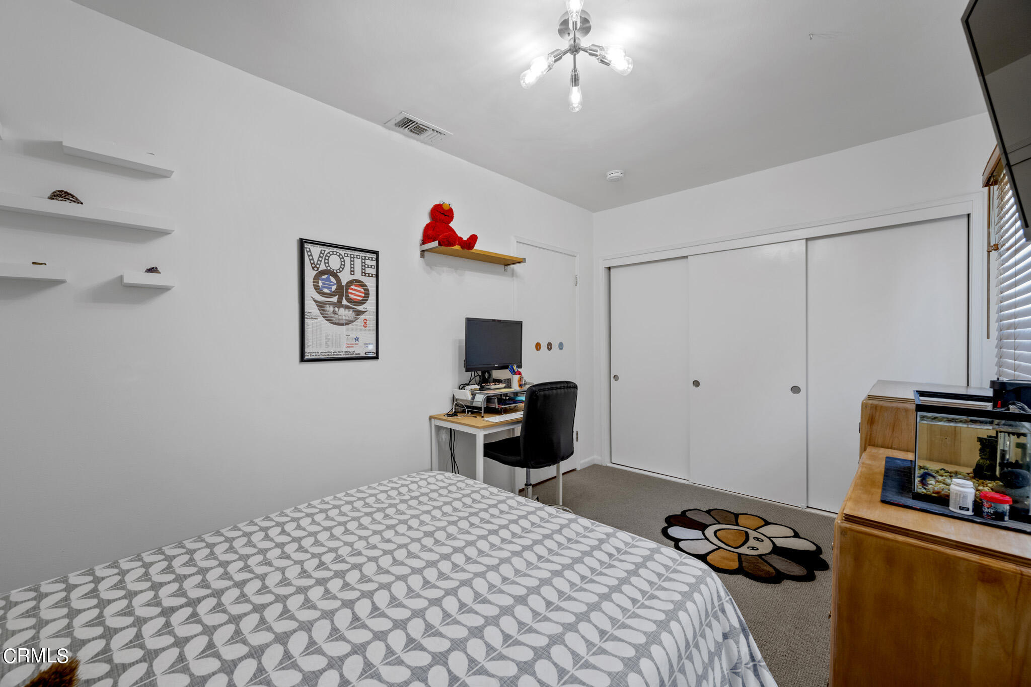 1817 Harmon Place Glendale, CA 91208 - Photo 28 of 45 a bedroom with a bed and a chandelier