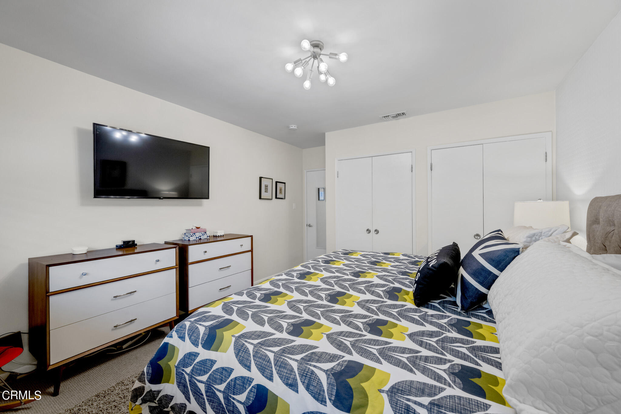 1817 Harmon Place Glendale, CA 91208 - Photo 30 of 45 a bedroom with a bed and a flat tv screen on the dresser