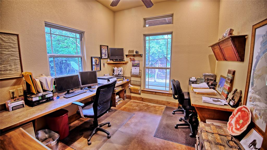 4509 Lazy E Road St. Jo, TX 76265 - Photo 4 of 39 a view of a workspace with furniture and a window