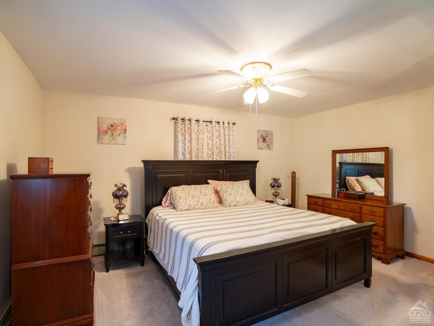 28 Allen Circle Stuyvesant, NY 12106 - Photo 17 of 41 a bedroom with a bed and a chandelier