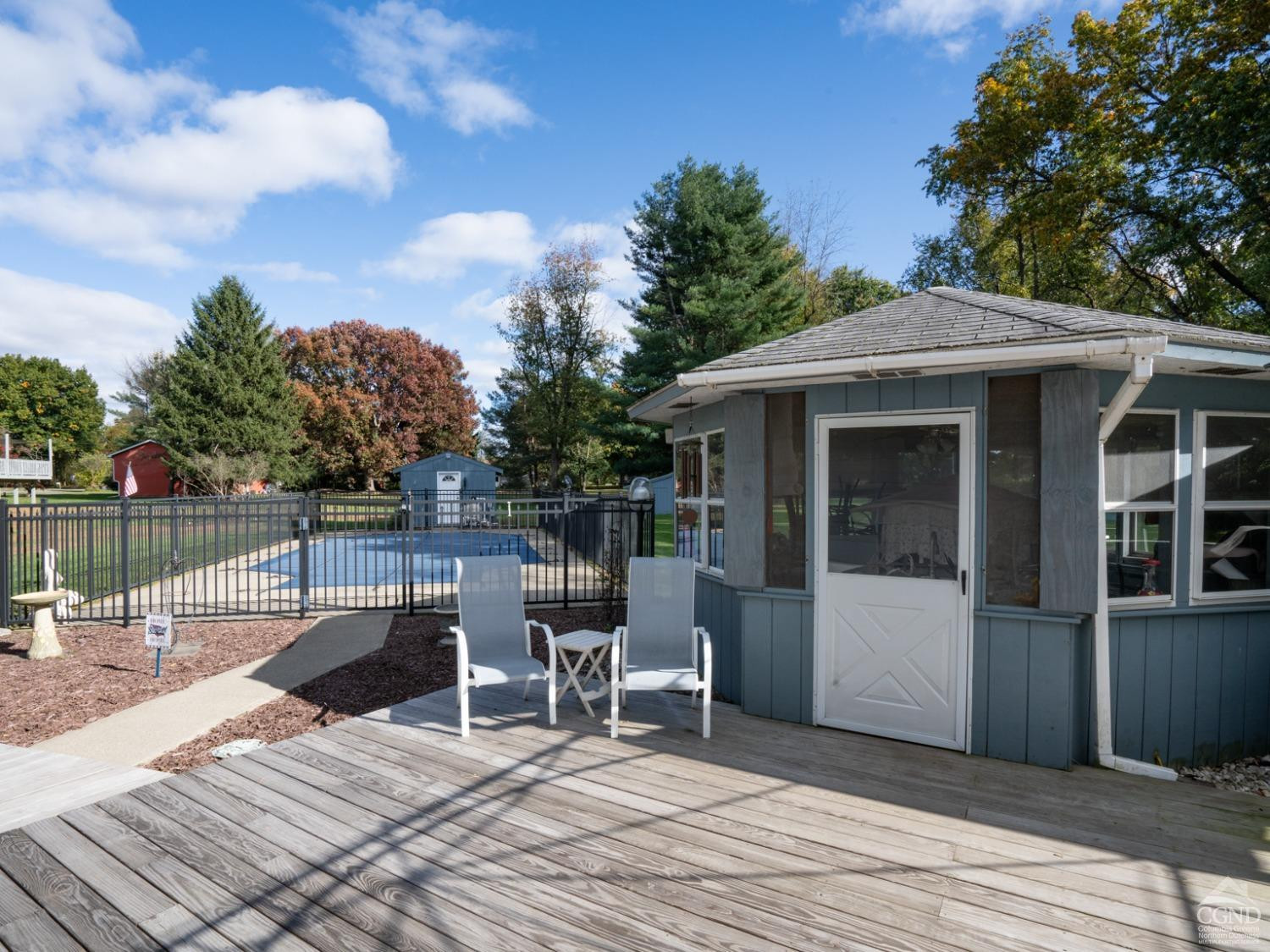 28 Allen Circle Stuyvesant, NY 12106 - Photo 27 of 41 a view of a patio with table and chairs with wooden floor and fence