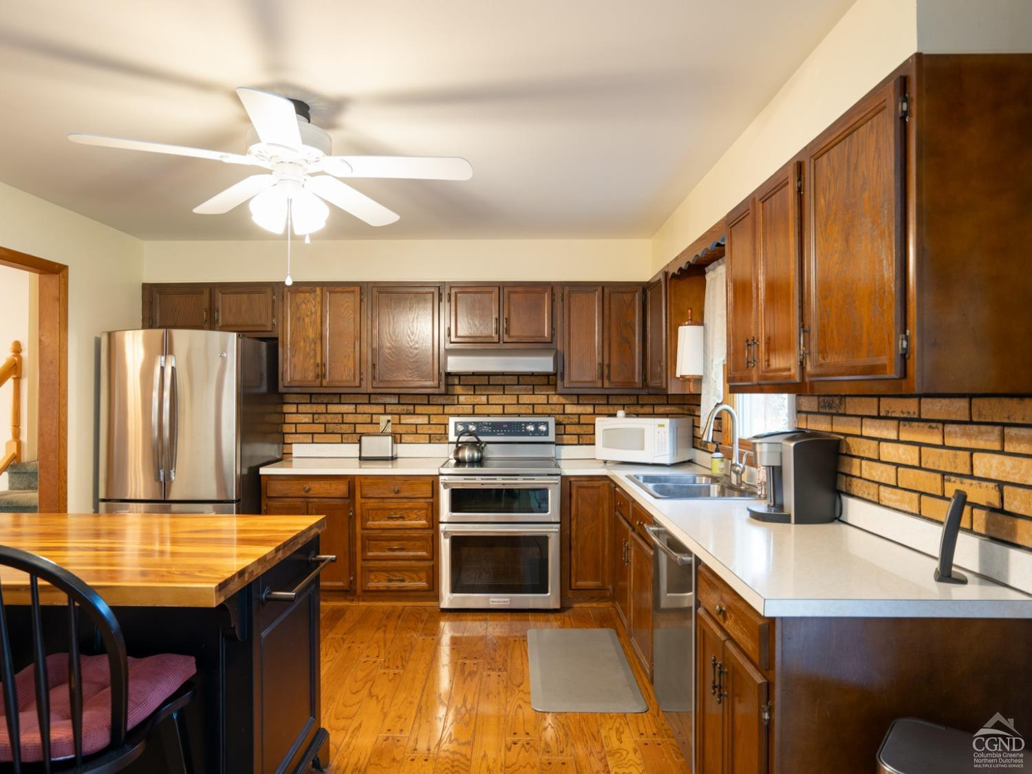 28 Allen Circle Stuyvesant, NY 12106 - Photo 8 of 41 a kitchen with kitchen island granite countertop a sink a counter top space appliances and cabinets
