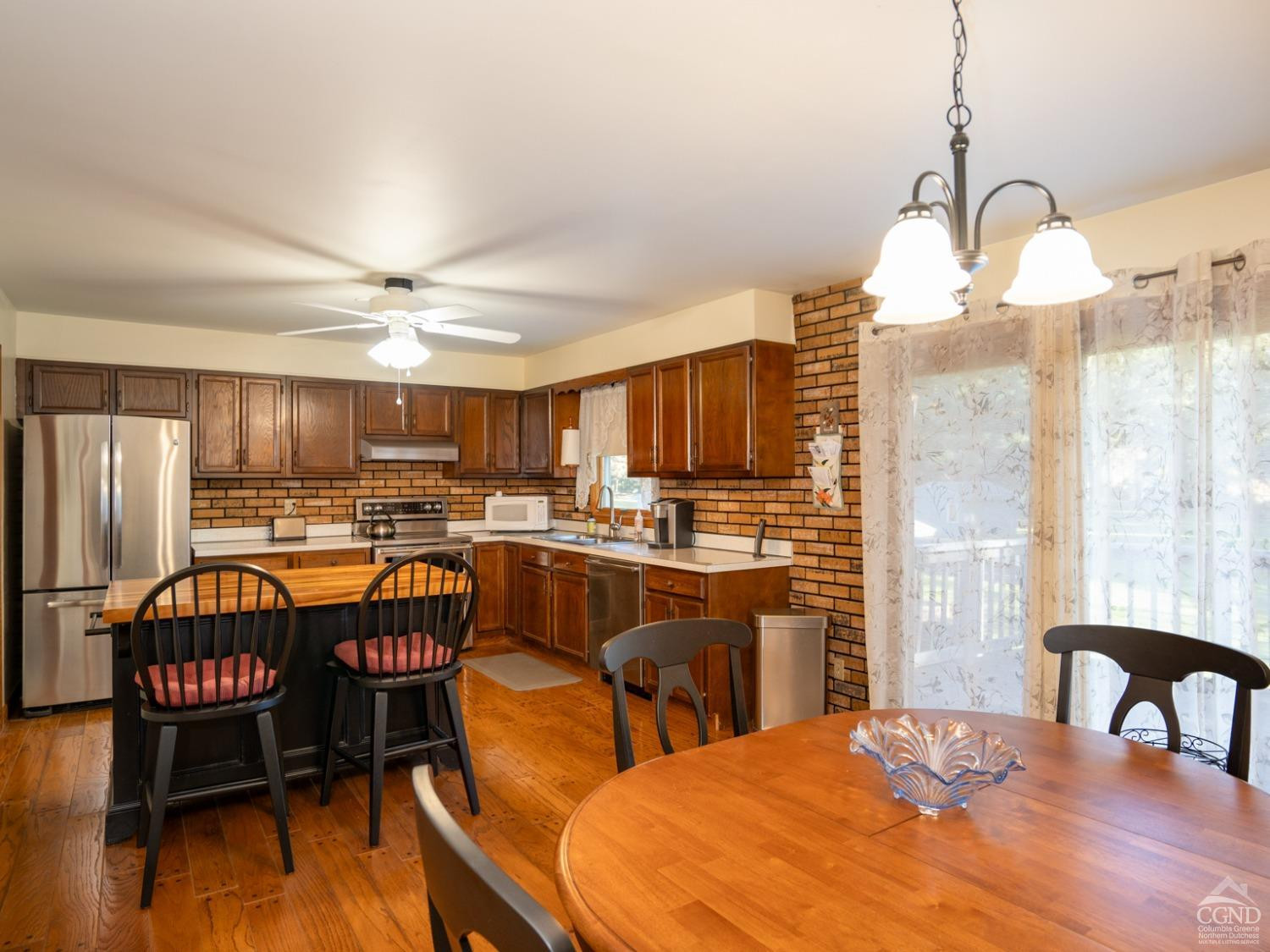 28 Allen Circle Stuyvesant, NY 12106 - Photo 9 of 41 a dining room with furniture a chandelier and wooden floor