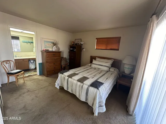 a bedroom with a bed and a closet