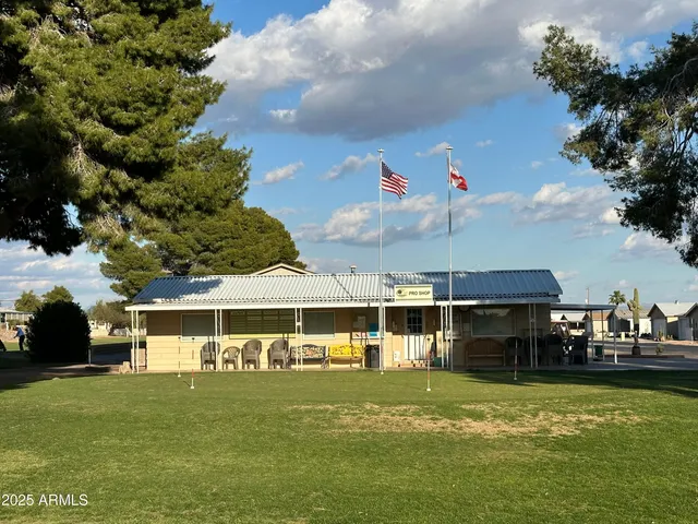 a view of a swimming pool with a yard