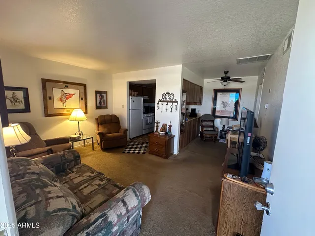 a living room with furniture a window and gym equipment