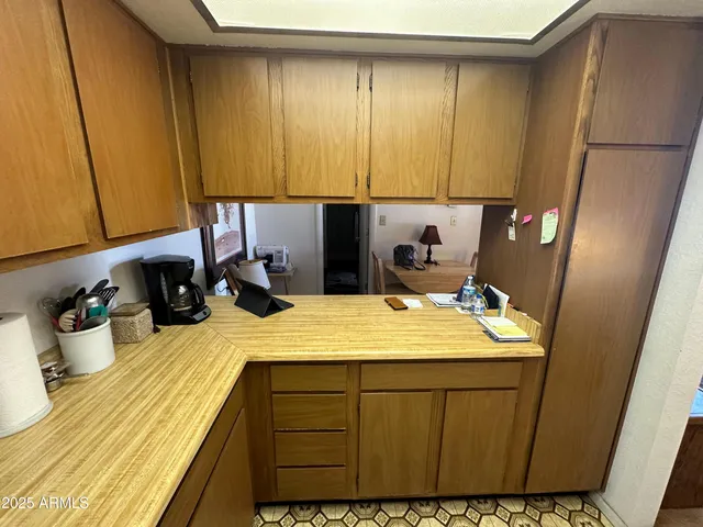 a room with a sink and cabinets