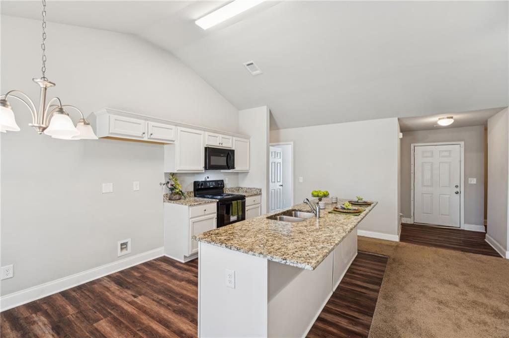 224 Katie Lane Commerce, GA 30529 - Photo 12 of 35 a kitchen with sink stove and refrigerator